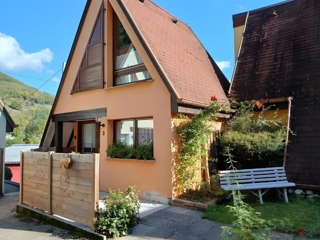a house with a bench in front of it at Gite Pinot Blanc n°3 à Kaysersberg in Kaysersberg