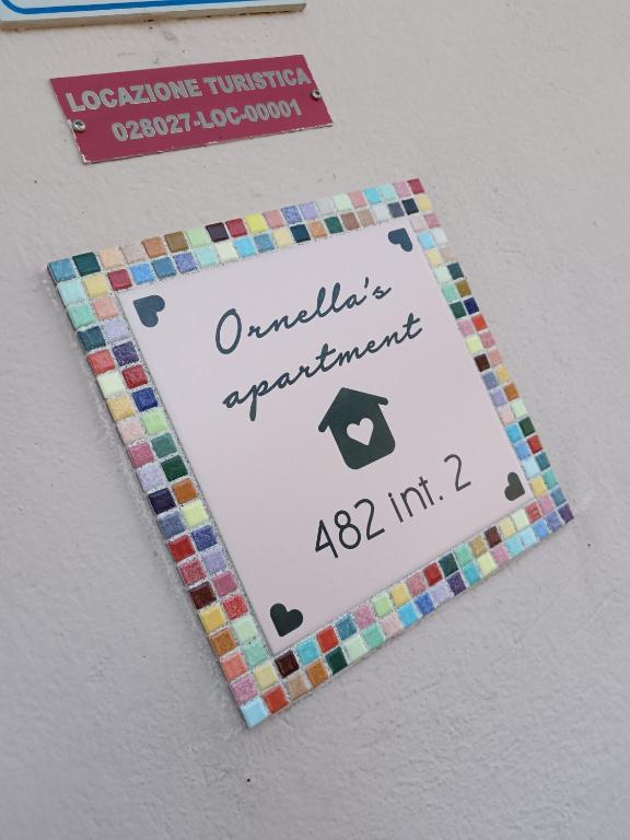 a sign for a playing card game on a wall at Ornella's apartment Relax-Wi-Fi e AC- ideale famiglie in Casale di Scodosia