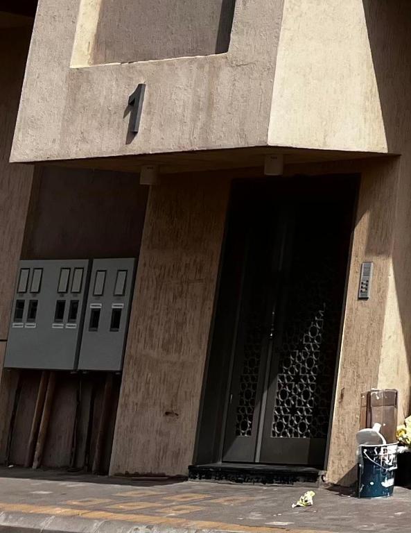 a building with a door full of wine bottles at شقة مخدومة 101 in Medina