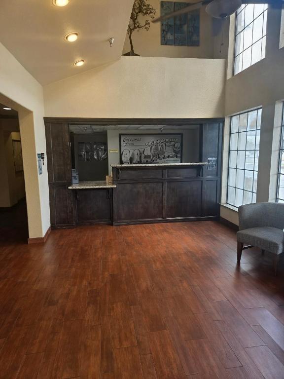 a large room with a hard wood floor and a waiting room at Super 10 Fairgrounds, I-40, Airport in Oklahoma City