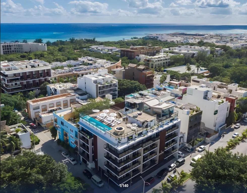 an aerial view of a city with the ocean at Serenity Hotel Boutique By Alsol in Playa del Carmen