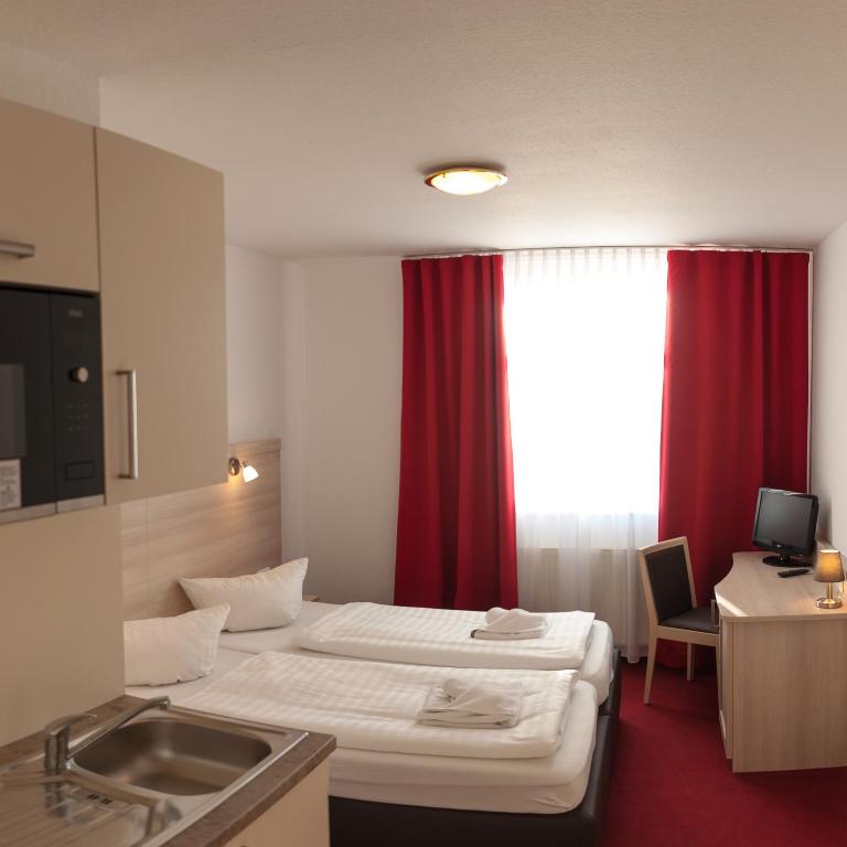 Postel nebo postele na pokoji v ubytování Apart Hotel Ferdinand Berlin