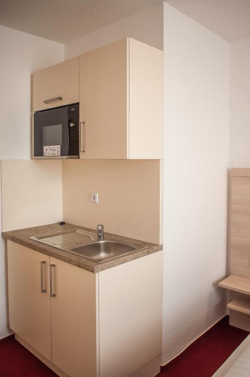 Kuchyň nebo kuchyňský kout v ubytování Apart Hotel Ferdinand Berlin