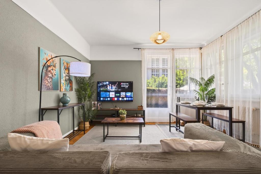 a living room with a couch and a table at Charming city in Lausanne