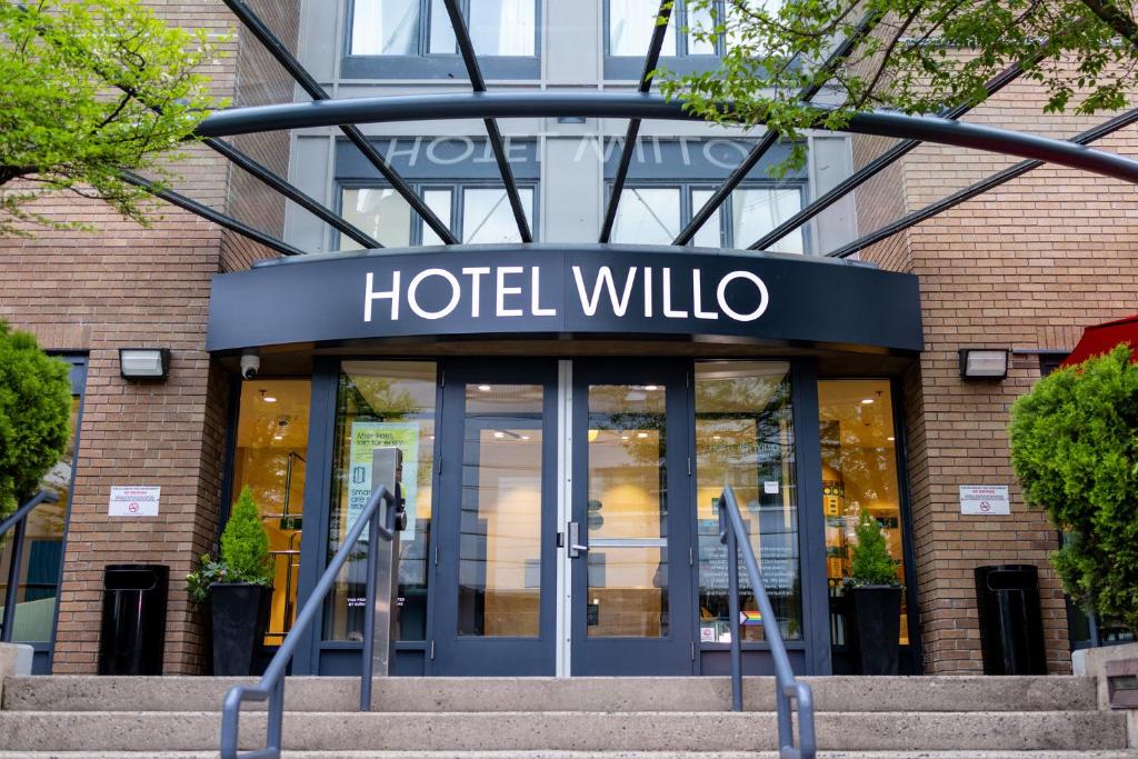 a hotel willula sign in front of a building at Hotel Willo - previously known YWCA Hotel in Vancouver