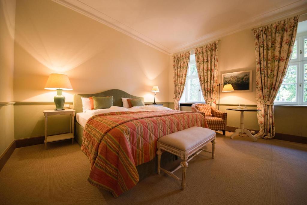 Postel nebo postele na pokoji v ubytování Hotel Château Bela