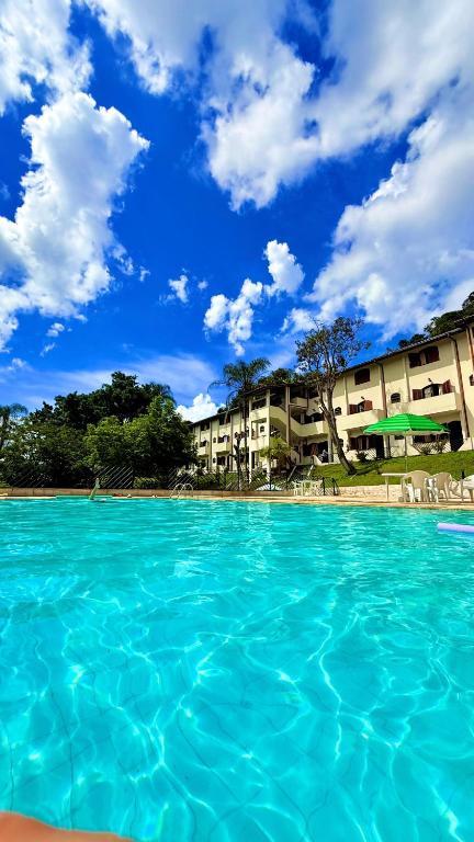 a view of the water in front of a resort at Hotel Moinho de Pedra in Serra Negra
