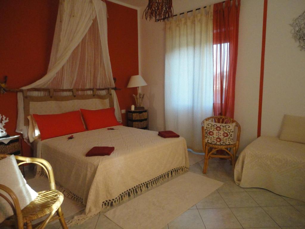 A bed or beds in a room at B&B Mare E Natura