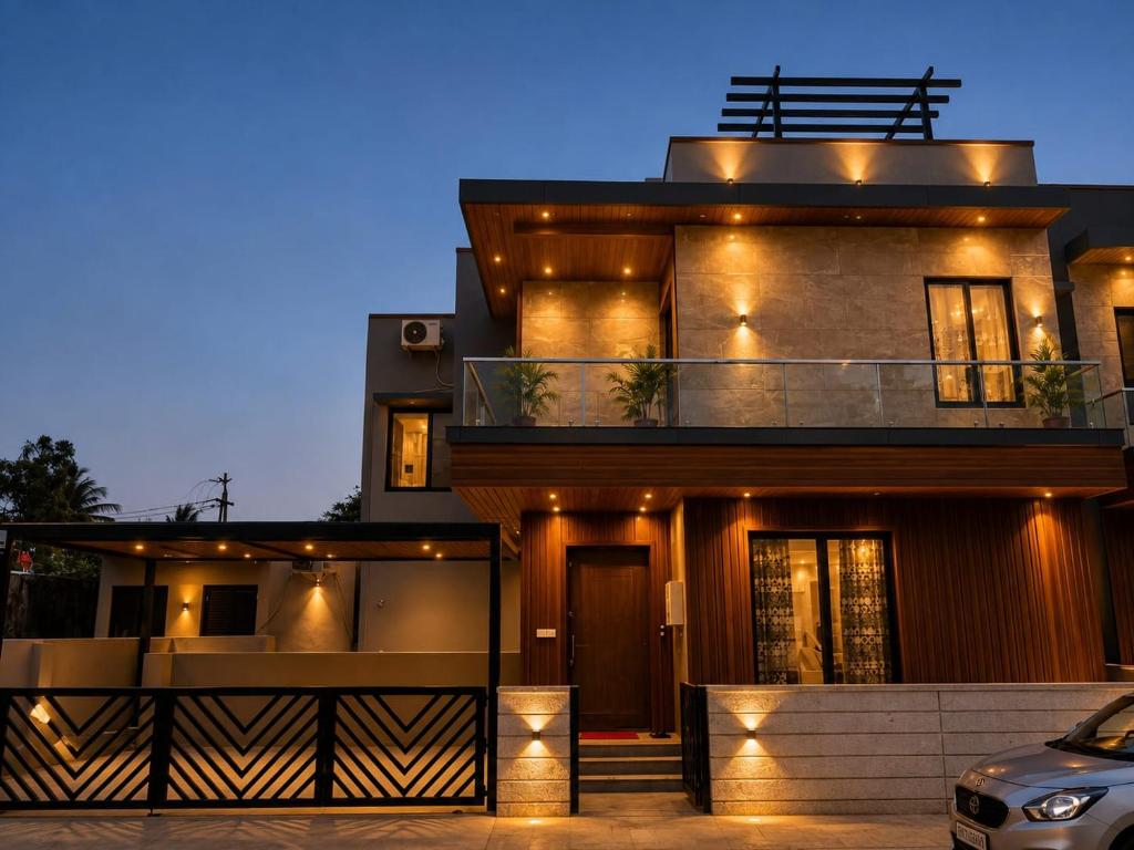 a house with a car parked in front of it at sea stay inn in Mahabalipuram