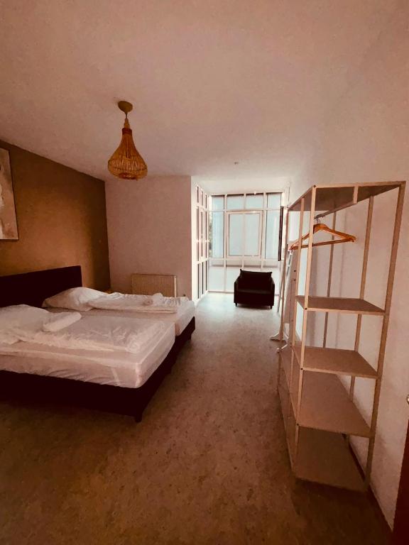 a bedroom with a bed and a ladder in it at Dorey Home DEG1- Business-Apart l vollküche l WLan l Terasse bis 7 Personen in Deggendorf