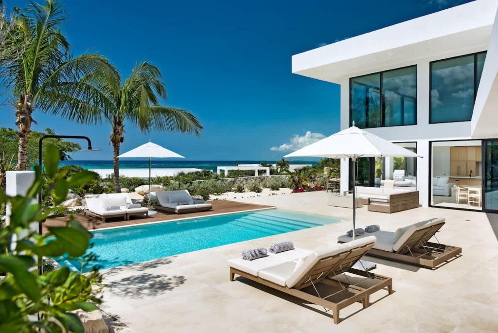 an image of a villa with a swimming pool at Beachwood Villa in Turtle Cove