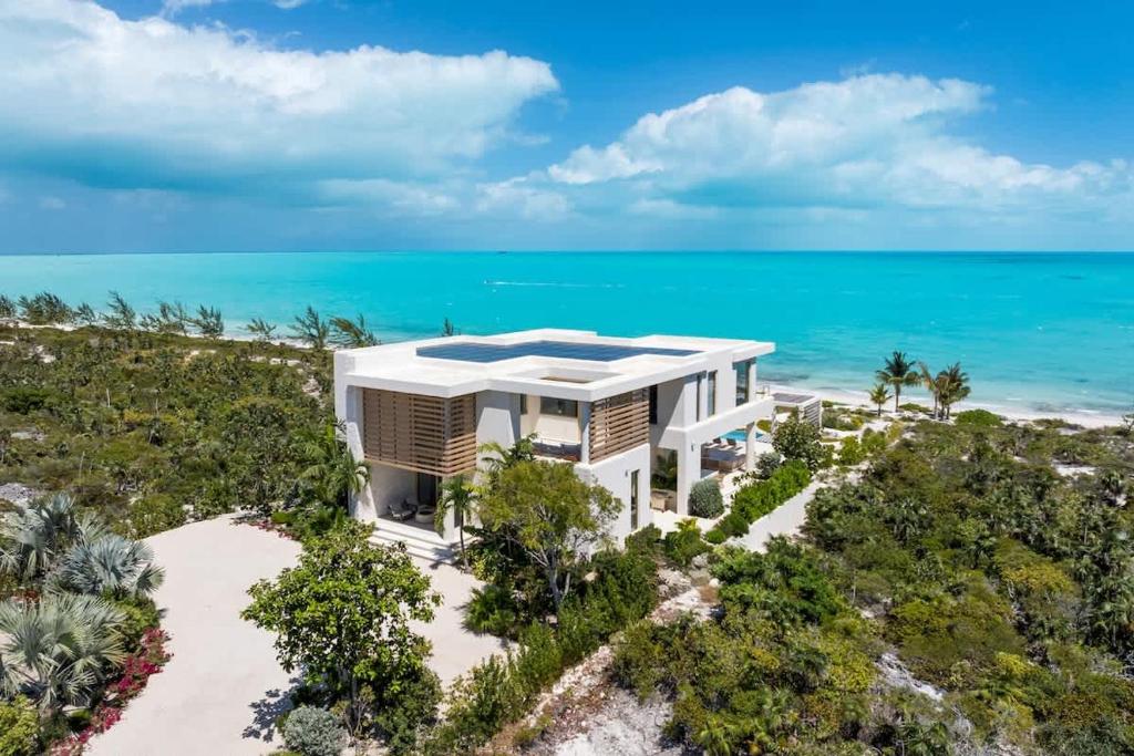 an aerial view of a house on the beach at Kailoa Villa in Long Bay Hills
