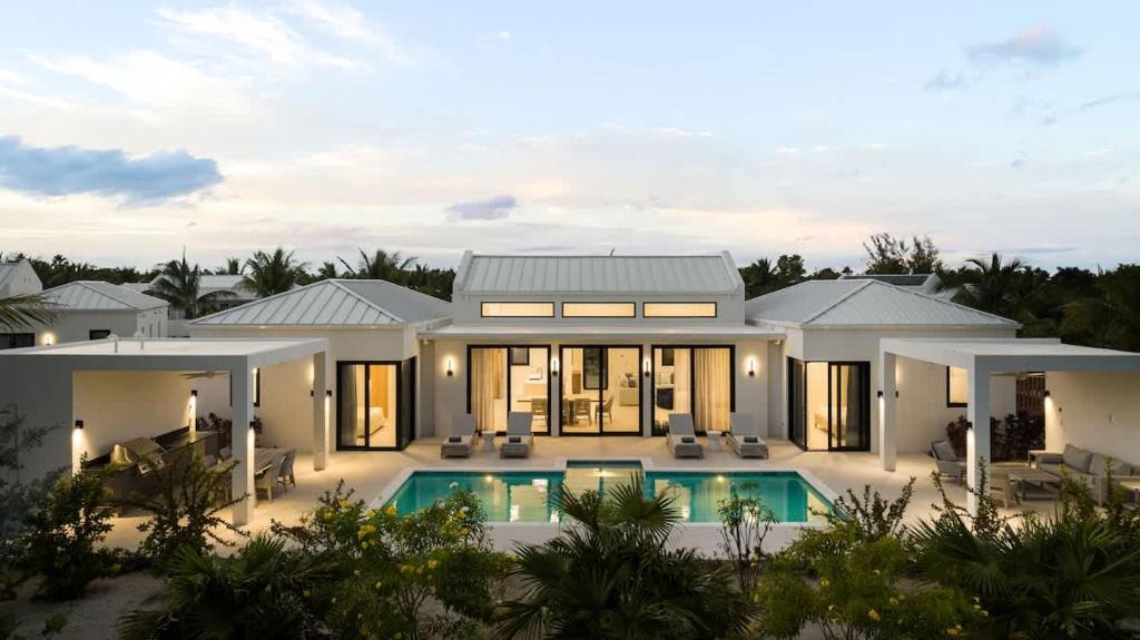 an aerial view of a villa with a swimming pool at Upper East Side Enclave # 18 in Leeward