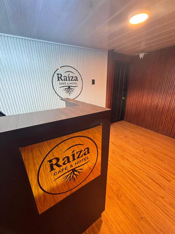 a podium in a room with two signs on the wall at Raiza Hotel in Concepción