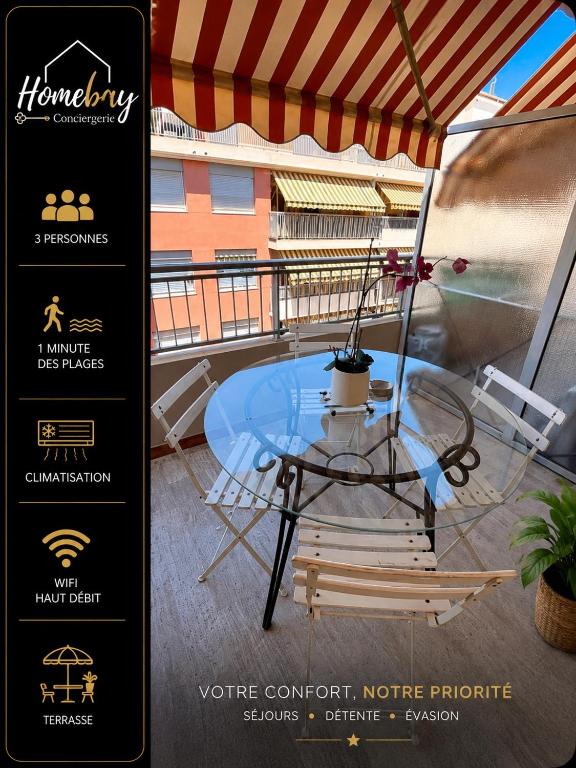 a glass table and a chair on a balcony at Le belgique ,1 minute plage in Vallauris