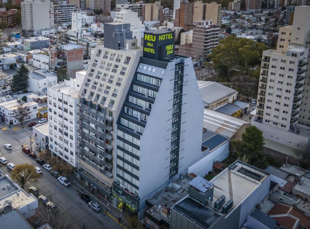 an overhead view of a tall white building in a city at Hotel NEU 354 in Neuquén