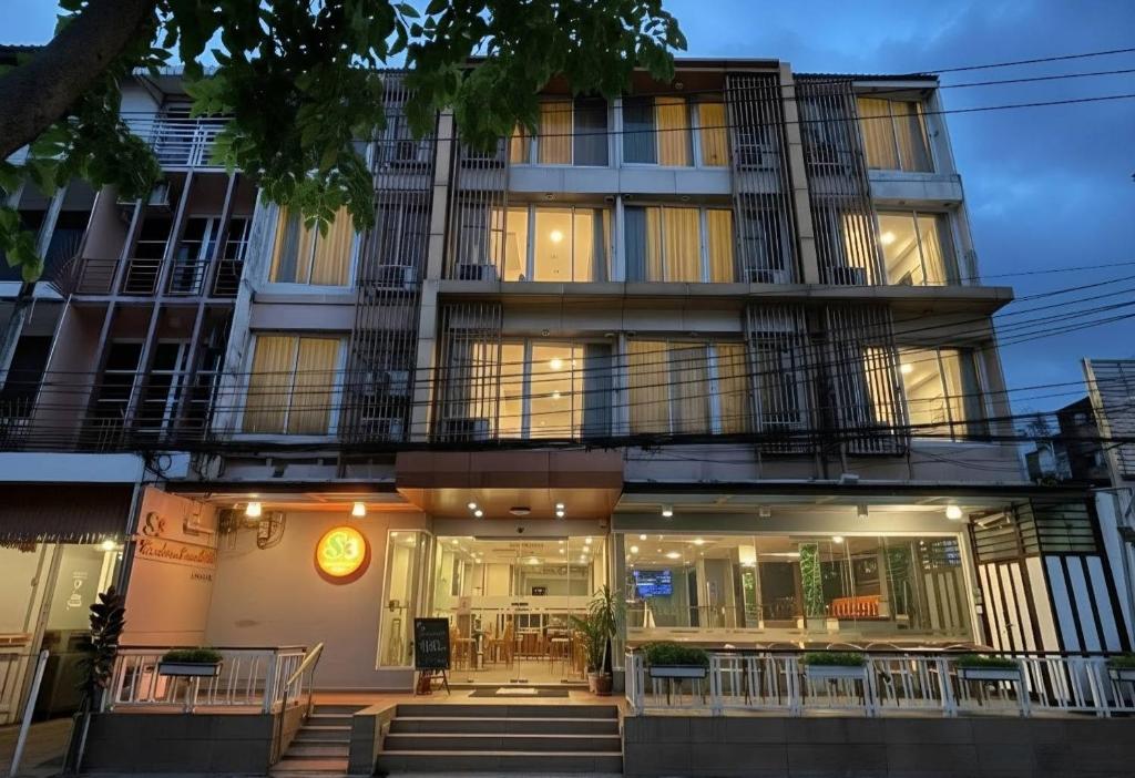 a building with a staircase in front of it at S3 Residence Park in Bangkok
