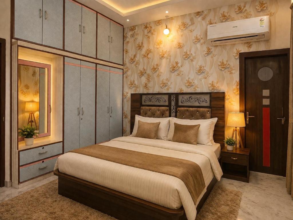a bedroom with a large bed in a room at Luxury Airy Retreat in Jaipur