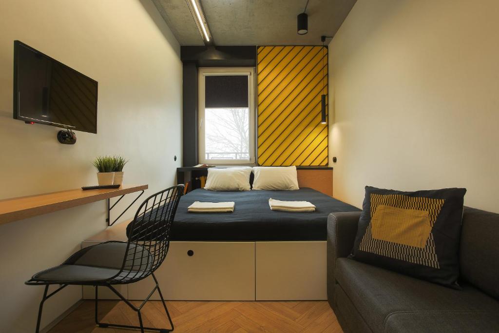Un pat sau paturi într-o cameră la Hostel Suffix