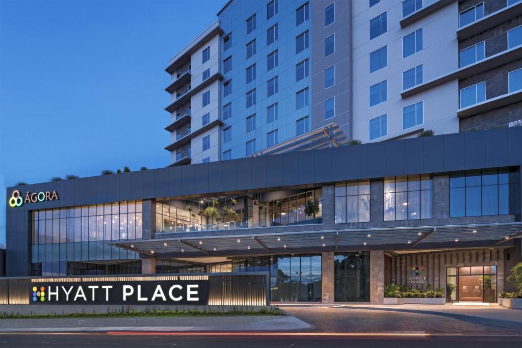 a view of a building with a night place at Hyatt Place San Pedro in San Pedro Sula