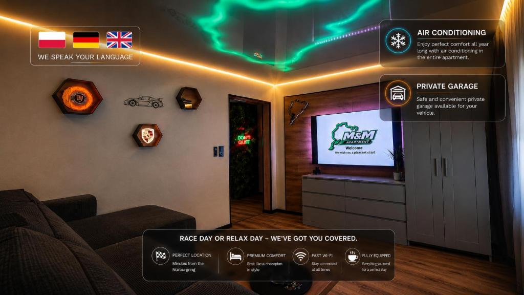 a living room with a tv and a couch at M&M Apartment Air Conditioning Garage in Adenau