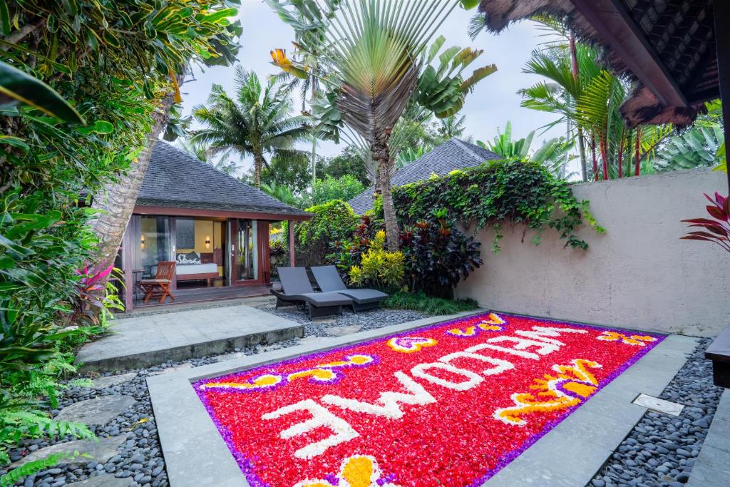 a happy new year rug in front of a house at Temuku Ubud Villas in Ubud