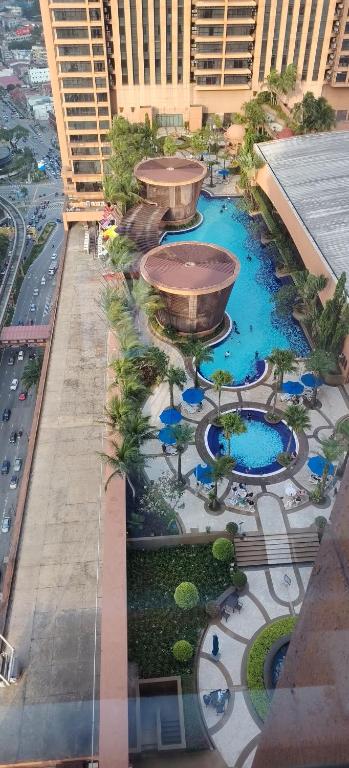 an aerial view of a building with a pool at Home Time Square Residence in Kuala Lumpur