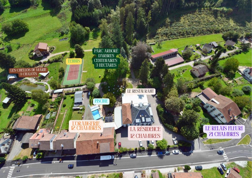 an overhead view of a village with houses and a road at Logis Hotel la Résidence in Le Val-dʼAjol