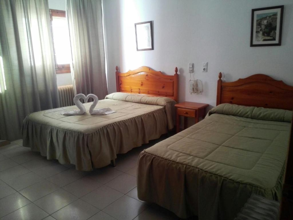Cama o camas de una habitación en Hostal Mulhacen