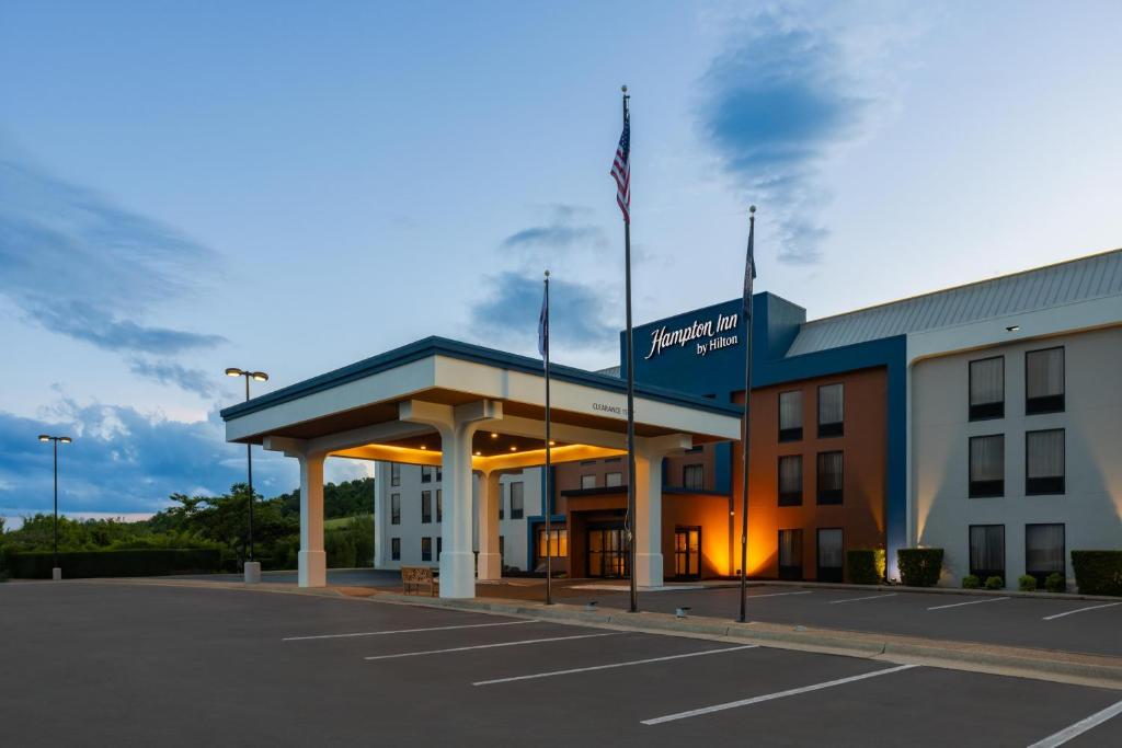 a building with a parking lot in front of it at Hampton Inn Staunton in Staunton