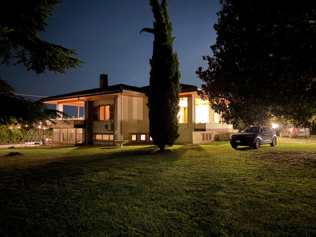 a car parked in front of a house at night at Villa Zina in Pasiano di Pordenone