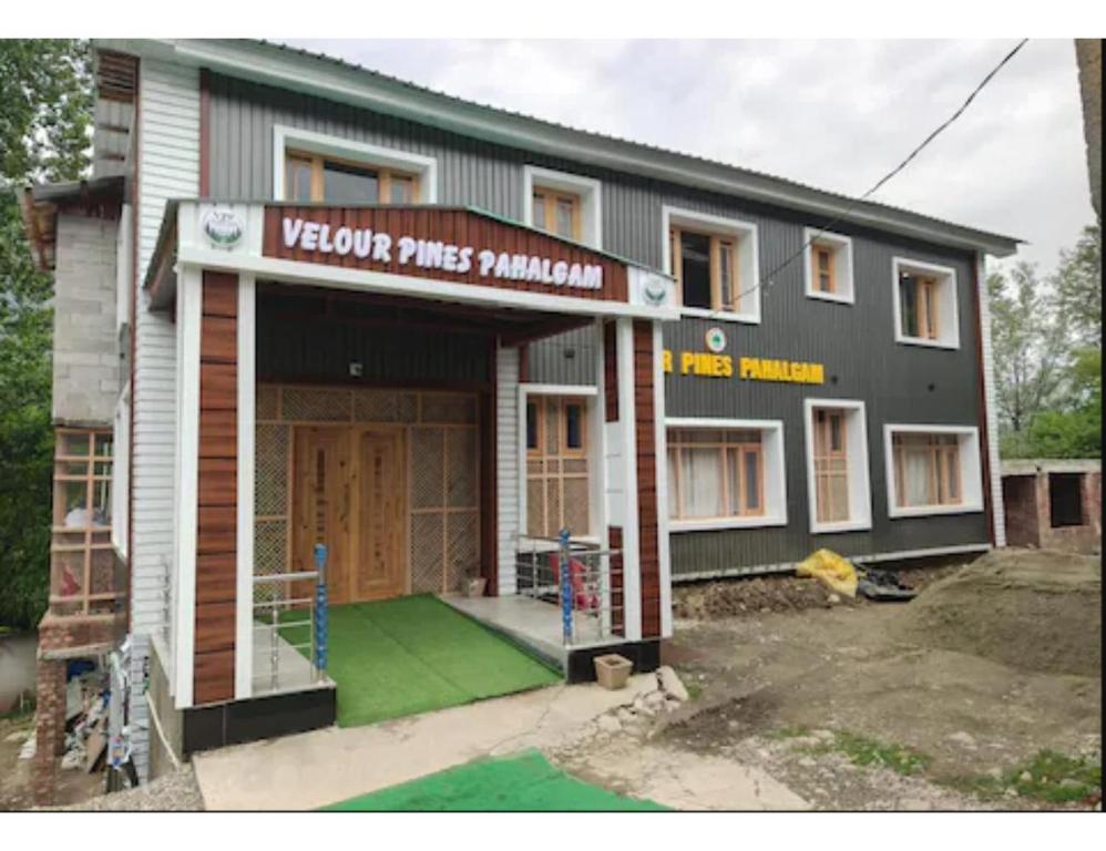 a building with a sign that reads victory pink samurai at Velour Pines Pahalgam in Pahalgām