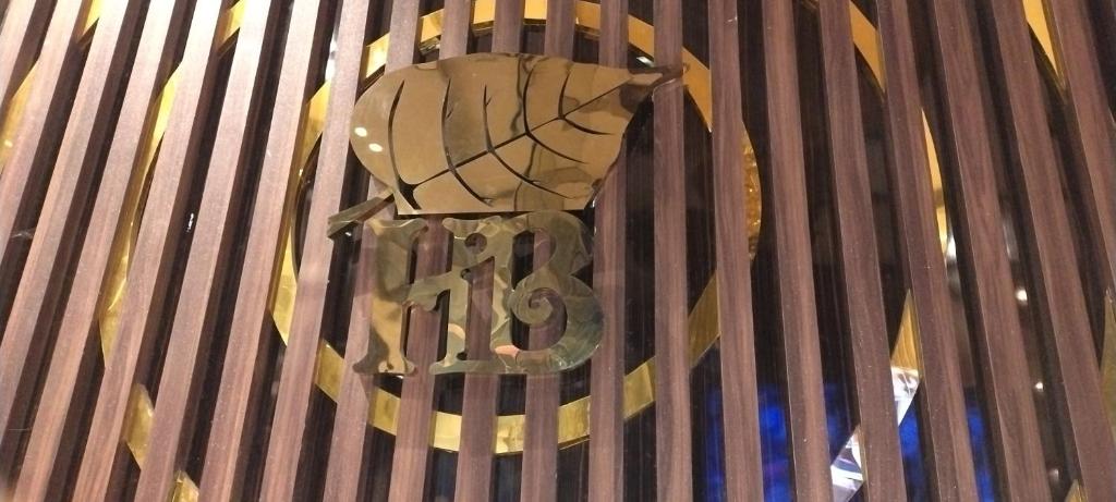 a metal clock on the side of a building at Hotel New bodhi inn in Gaya