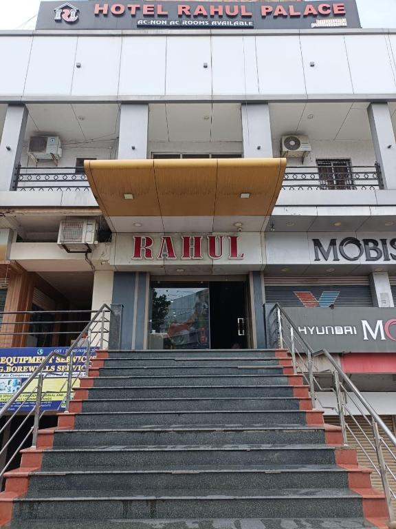 a building with stairs leading up to a hotel room palace at Hotel Rahul Palace in Nagpur
