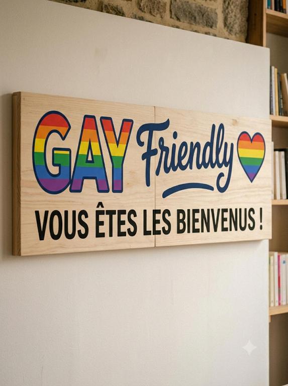 a sign on a wall that reads say friendly washes liesbenxs at lgbt friendly in Dinan