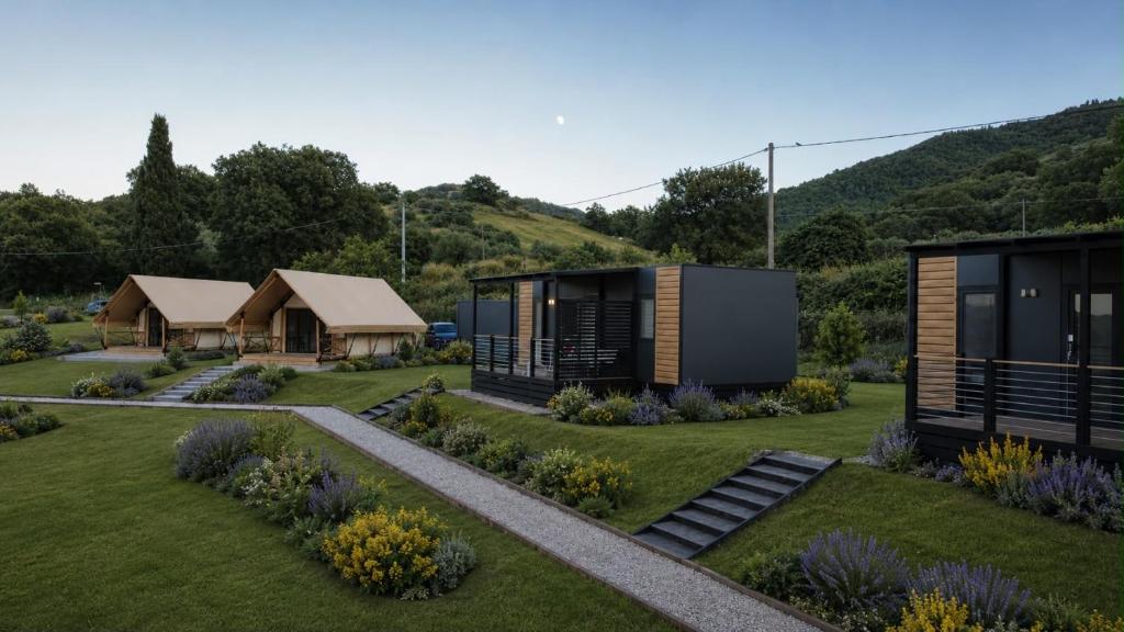 a modular home in a garden with a house at simami resort in Caldarola