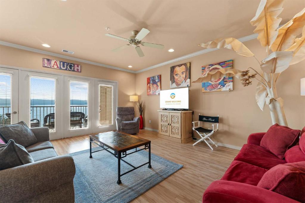 a living room with a couch and a table at Smirnoff Pointe Lakefront in Hollister