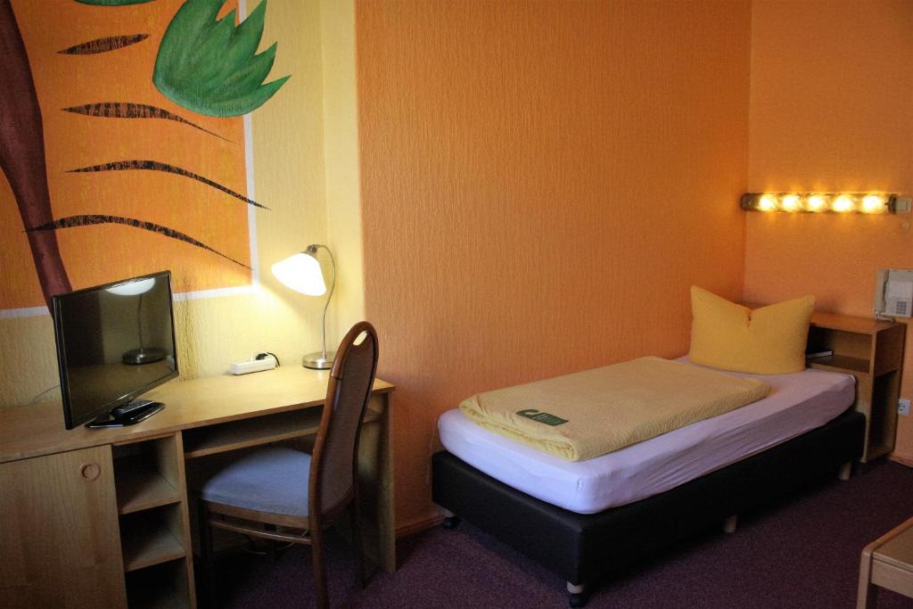 Postel nebo postele na pokoji v ubytování Hotel Graf Pückler