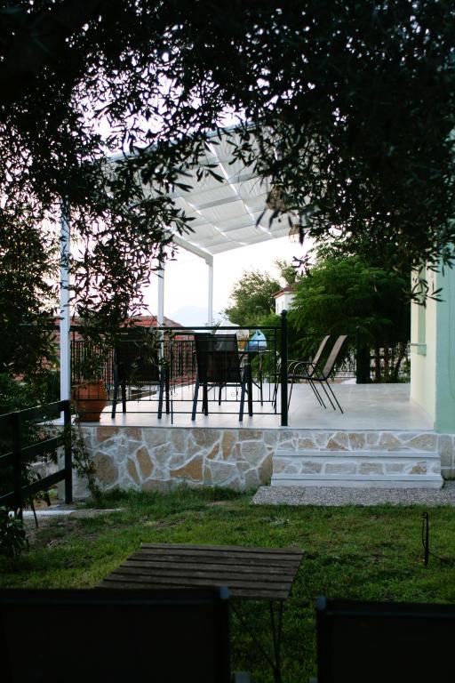 a patio with a table and chairs on it at Sunset House in Kanallákion