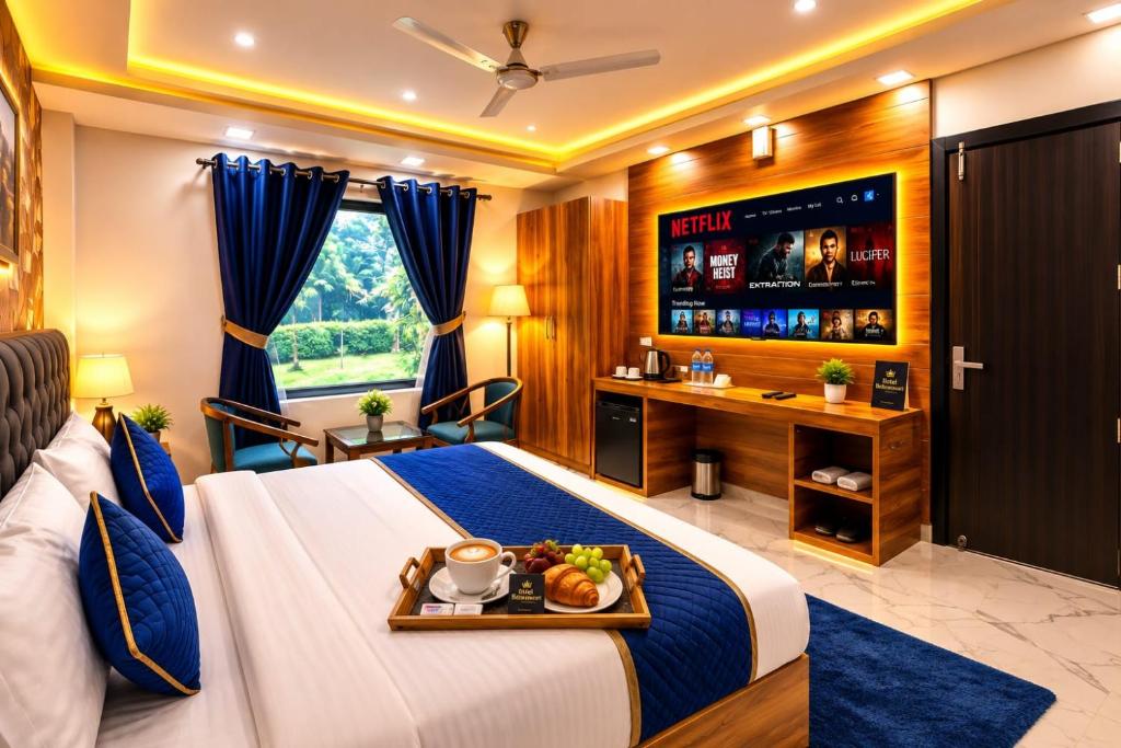 a hotel room with a bed with a tray of food on it at Hotel Aura Bellamonts Near Delhi Airport- Free Airport PickUp & Drop , Breakfast & Dinner Complementary in New Delhi