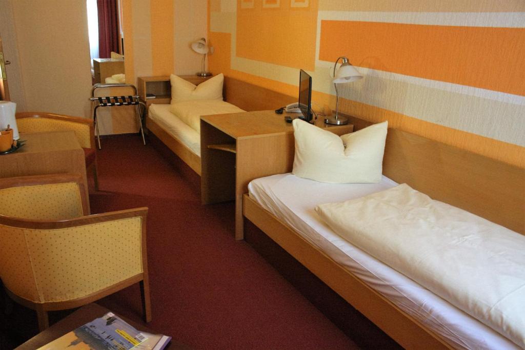 Postel nebo postele na pokoji v ubytování Hotel Graf Pückler