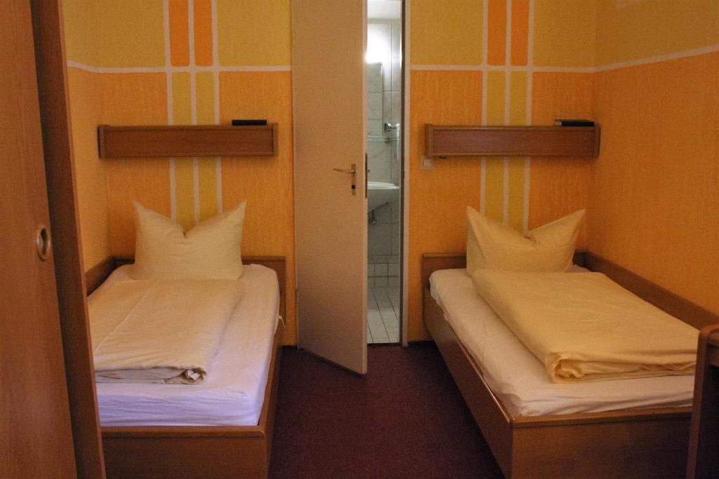 Postel nebo postele na pokoji v ubytování Hotel Graf Pückler
