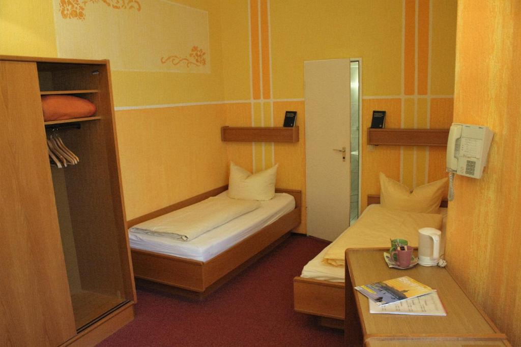 Postel nebo postele na pokoji v ubytování Hotel Graf Pückler