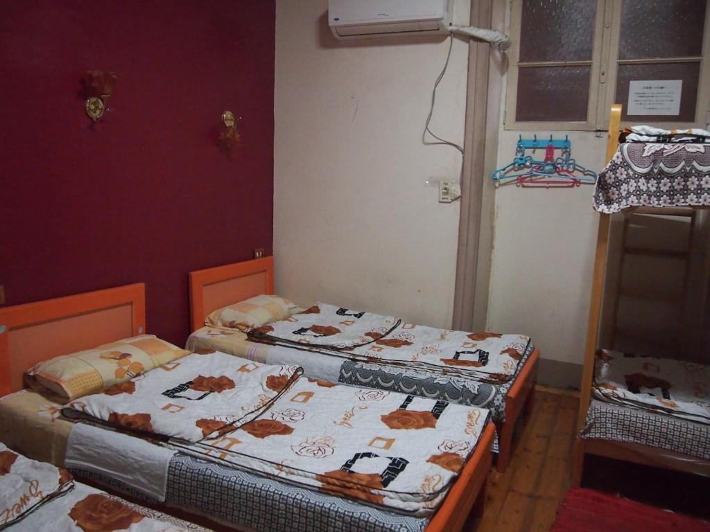 Postel nebo postele na pokoji v ubytování Venice Hosokawaya