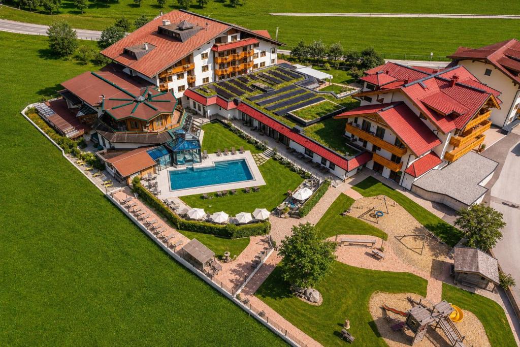an aerial view of a house with a swimming pool at Ferienhotel Sonnenhof in Zell am Ziller