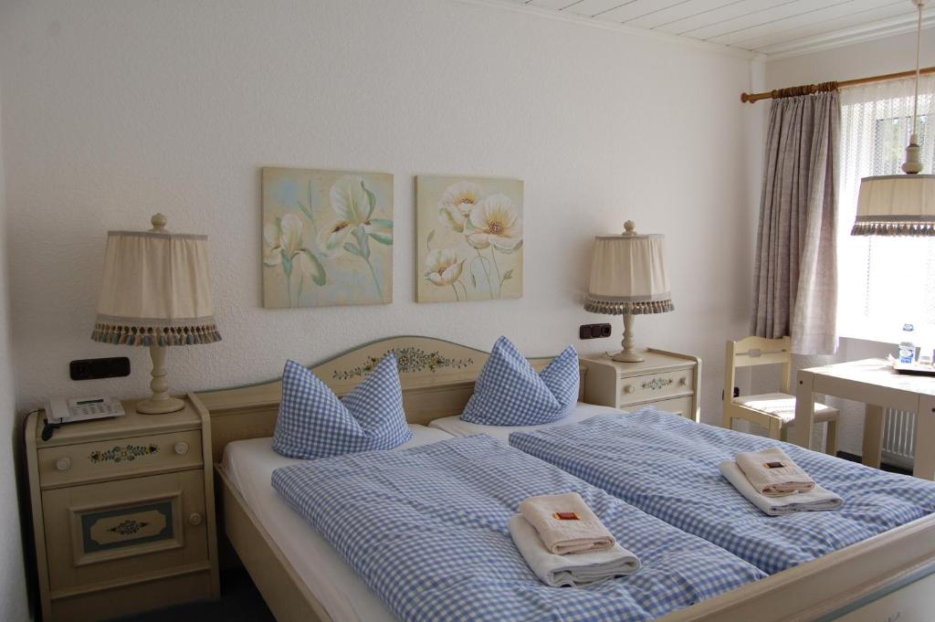 Postel nebo postele na pokoji v ubytování Landhaus Brockenblick