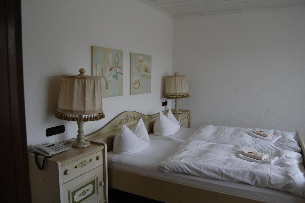 Postel nebo postele na pokoji v ubytování Landhaus Brockenblick