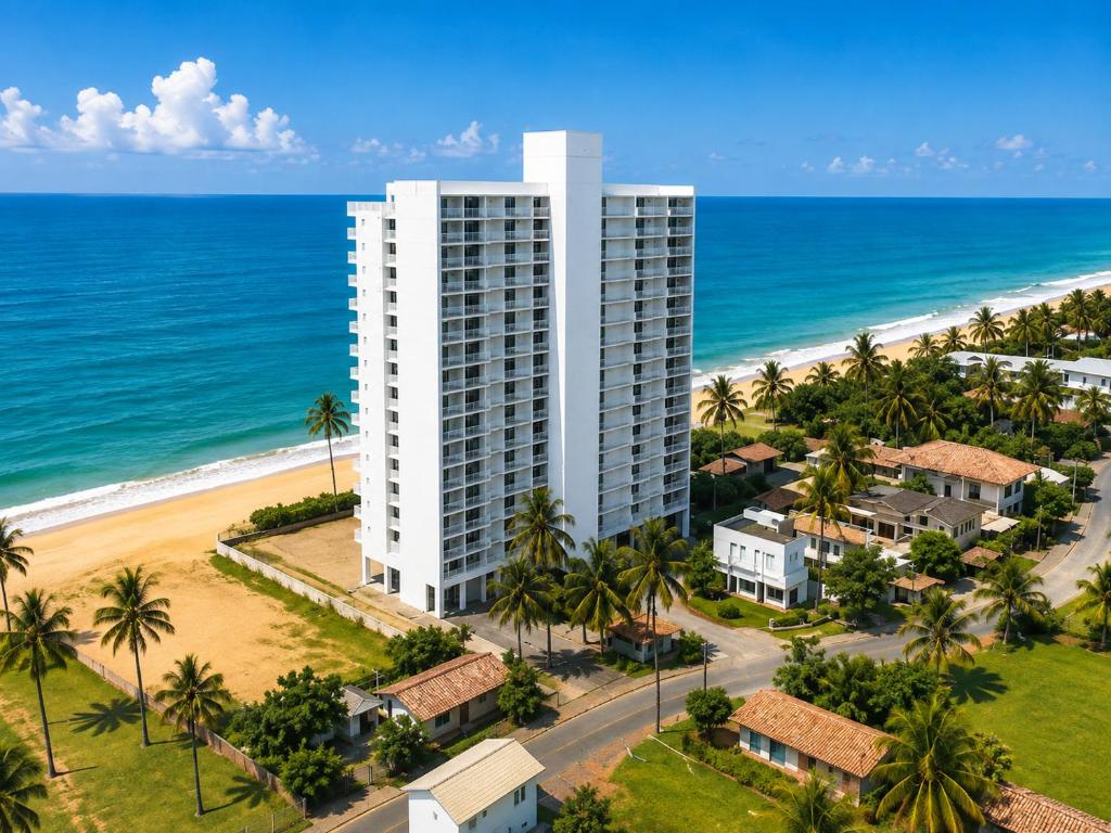 an aerial view of a building and the beach at Beachfront Sky Studio with Ocean View in Wattala