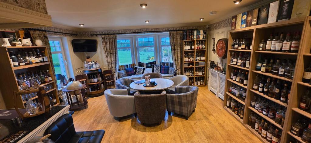 a wine tasting room with a table and chairs at The Gables Whisky B&B in Dufftown