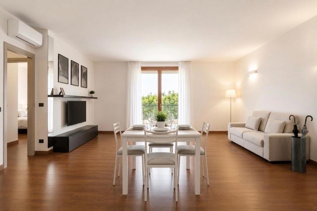 a living room with a table and a couch at Civico 44 - vicino al Centro Storico, Ospedale e Centro Iperbarico in Ravenna